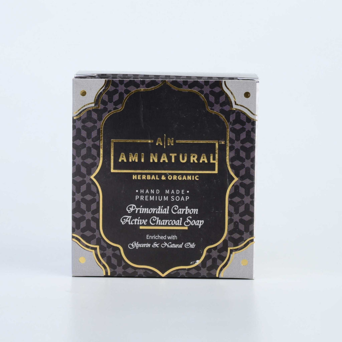AMI NATURAL ACTIVATED CHARCOAL SOAP in black and gold packaging with herbal and organic label, handcrafted premium soap box