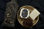 AMI NATURAL BLACK OUDH SOAP pack of 6 with elegant black and gold packaging and a white soap bar in a woven basket