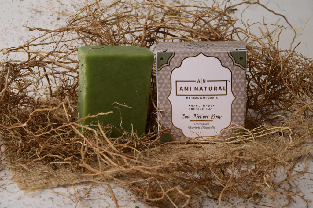 AMI NATURAL COOL VETIVAR SOAP green herbal soap bar with its beige and green packaging surrounded by dried vetiver roots