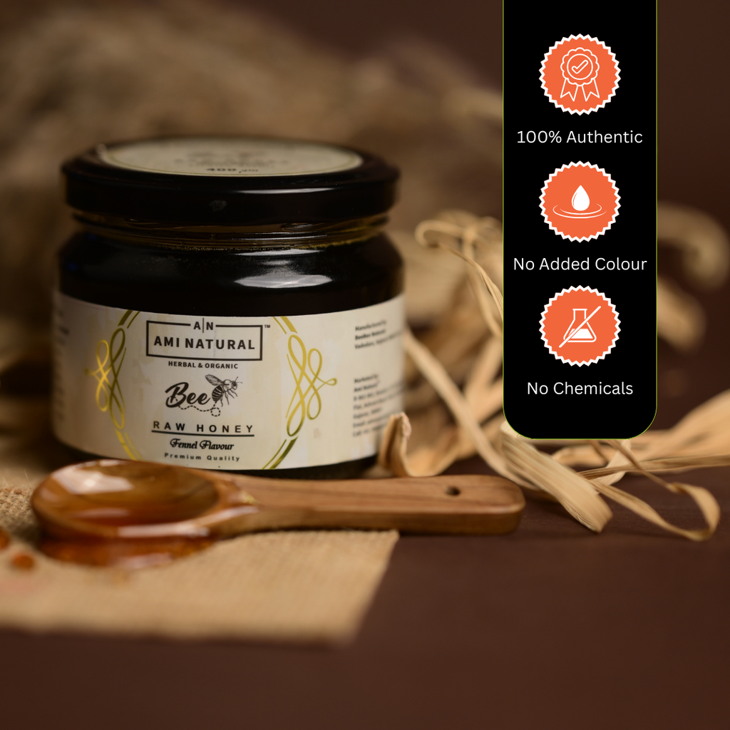 Ami Natural Raw Fennel Honey in a glass jar with black lid featuring a white label, placed beside a wooden spoon and dried fennel seeds